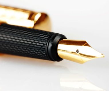 gold ink pen with black rubber handling